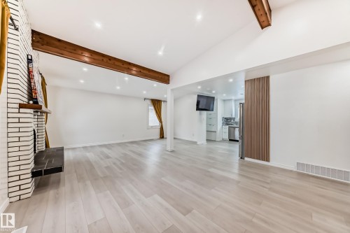 Unfurnished living room with recessed lighting, vaulted ceiling, and light wood-style flooring - 10519 173 Avenue, Edmonton, AB - Indoor Photo Showing Other Room