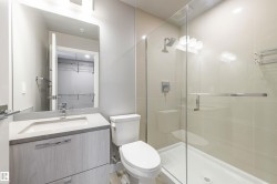 Full bath with vanity, a shower stall, and a spacious closet - 