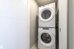 Laundry room with estacked washer and dryer - 