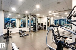 Workout area featuring a paneled ceiling - 