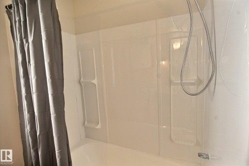 Bathroom with shower / bath combination with curtain - 11512 67 Street, Edmonton, AB - Indoor Photo Showing Bathroom