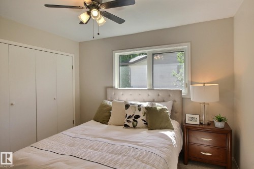 Bedroom featuring a closet, a ceiling fan, and carpet floors - 11512 67 Street, Edmonton, AB - Indoor Photo Showing Bedroom
