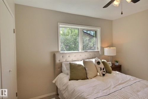 Bedroom featuring ceiling fan and baseboards - 11512 67 Street, Edmonton, AB - Indoor Photo Showing Bedroom