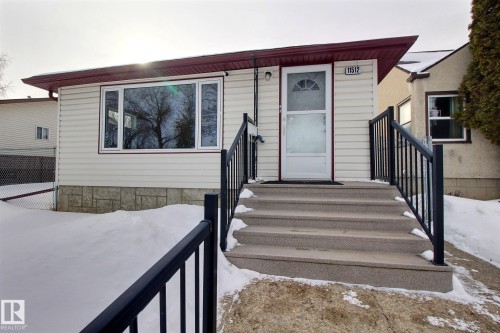 View of snow covered property entrance - 11512 67 Street, Edmonton, AB - Outdoor With Exterior
