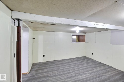 Below grade area featuring dark wood-style flooring - 11512 67 Street, Edmonton, AB - Indoor