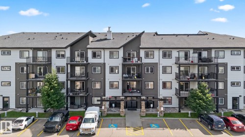 View of apartment building / complex with uncovered parking - 209 3353 16A, Edmonton, AB - Outdoor With Facade