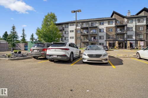 View of uncovered parking lot - 209 3353 16A, Edmonton, AB - Outdoor With Facade