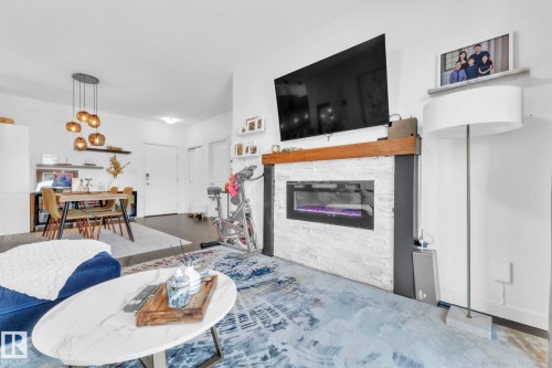 203 812 Welsh Drive, Edmonton, AB - Indoor Photo Showing Living Room With Fireplace