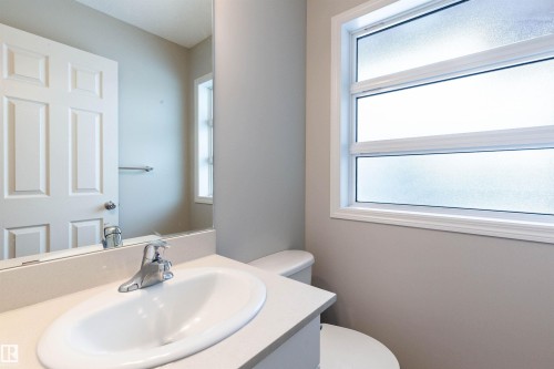 Half bath with vanity and toilet - 17259 9A Avenue Sw, Edmonton, AB - Indoor Photo Showing Bathroom
