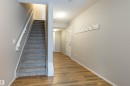 Stairs with wood finished floors and a textured ceiling - 17259 9A Avenue Sw, Edmonton, AB  - Indoor Photo Showing Other Room 