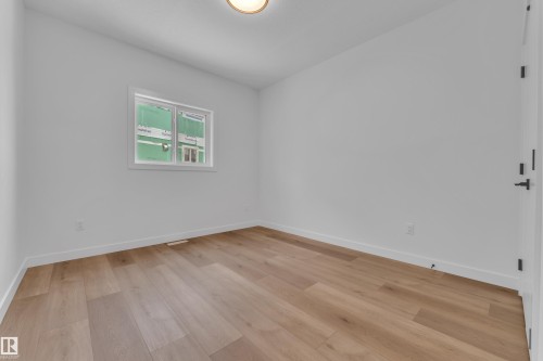 Spare room featuring light wood-style flooring - 159 Graybriar Dr, Stony Plain, AB - Indoor Photo Showing Other Room