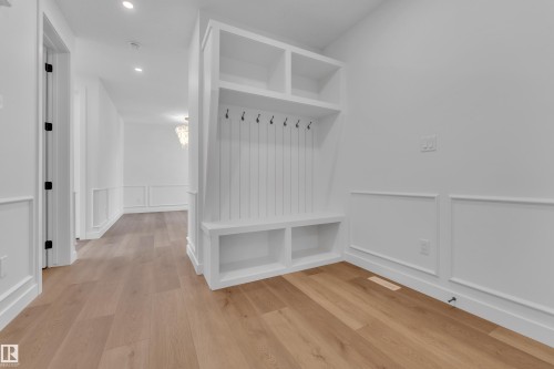 Mudroom featuring a wainscoted wall, a decorative wall, light wood finished floors, and recessed lighting - 159 Graybriar Dr, Stony Plain, AB - Indoor Photo Showing Other Room