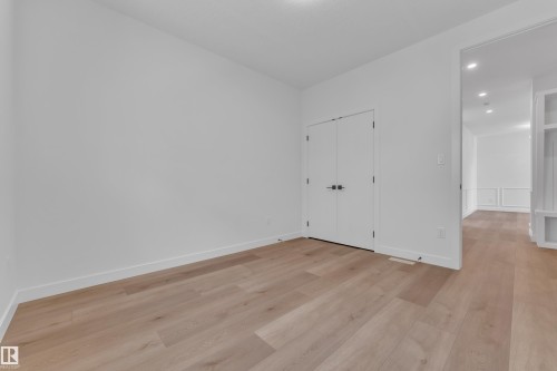 Unfurnished bedroom with light wood-style flooring, recessed lighting, and a closet - 159 Graybriar Dr, Stony Plain, AB - Indoor Photo Showing Other Room