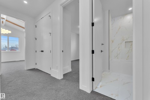 Corridor with recessed lighting, lofted ceiling, and light carpet - 159 Graybriar Dr, Stony Plain, AB - Indoor Photo Showing Other Room