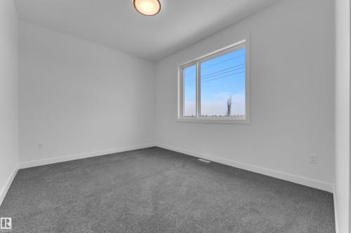Carpeted empty room featuring baseboards - 159 Graybriar Dr, Stony Plain, AB - Indoor Photo Showing Other Room