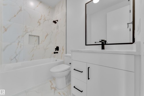 Bathroom featuring vanity, shower / bathtub combination, and light marble finish floors - 159 Graybriar Dr, Stony Plain, AB - Indoor Photo Showing Bathroom