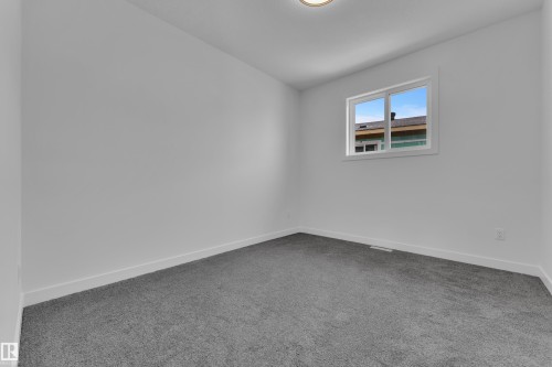 Spare room with carpet flooring and baseboards - 159 Graybriar Dr, Stony Plain, AB - Indoor Photo Showing Other Room