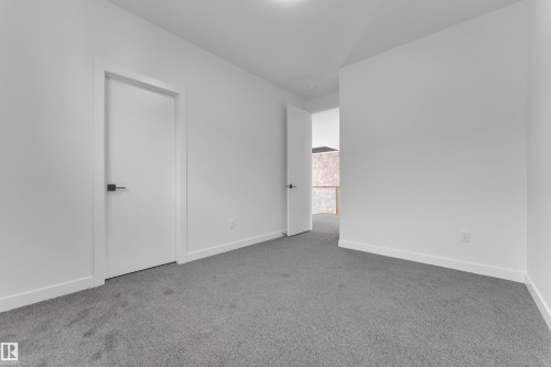 Spare room featuring light carpet and baseboards - 159 Graybriar Dr, Stony Plain, AB - Indoor Photo Showing Other Room