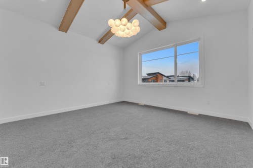 Unfurnished room with carpet and beamed ceiling - 159 Graybriar Dr, Stony Plain, AB - Indoor Photo Showing Other Room