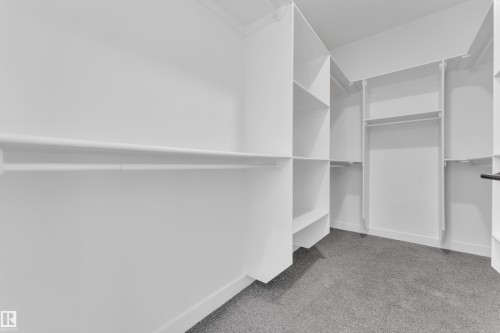 Walk in closet with light colored carpet - 159 Graybriar Dr, Stony Plain, AB - Indoor With Storage