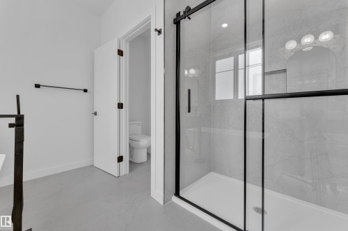 Bathroom featuring a marble finish shower and light marble finish flooring - 159 Graybriar Dr, Stony Plain, AB - Indoor Photo Showing Bathroom