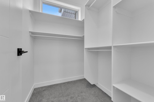 Walk in closet with light colored carpet - 159 Graybriar Dr, Stony Plain, AB - Indoor With Storage