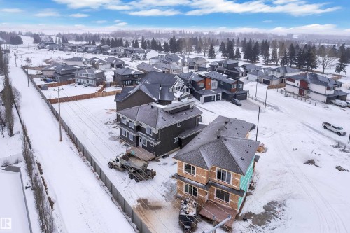 Snowy aerial view featuring a residential view - 159 Graybriar Dr, Stony Plain, AB - Outdoor With View