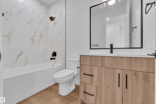 Bathroom featuring vanity,  shower combination, and light wood-type flooring - 159 Graybriar Dr, Stony Plain, AB - Indoor Photo Showing Bathroom