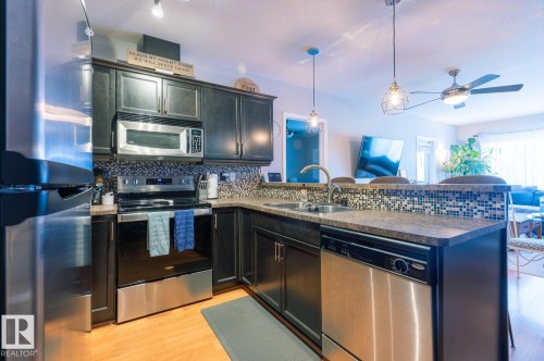 9 671 Silver Berry Road Nw, Edmonton, AB - Indoor Photo Showing Kitchen With Double Sink With Upgraded Kitchen