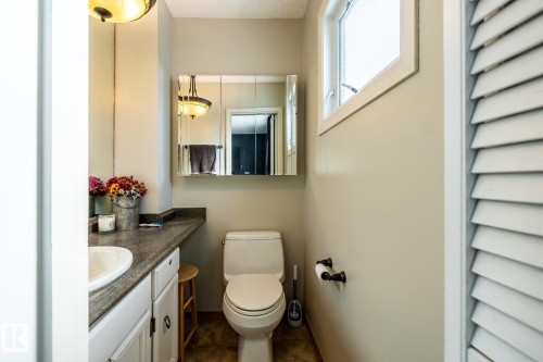 Half bathroom featuring toilet and vanity - 69 Amherst Crescent, St. Albert, AB - Indoor Photo Showing Bathroom