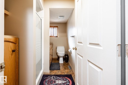 Bathroom featuring a stall shower, stone finish floors, and vanity - 69 Amherst Crescent, St. Albert, AB - Indoor Photo Showing Bathroom