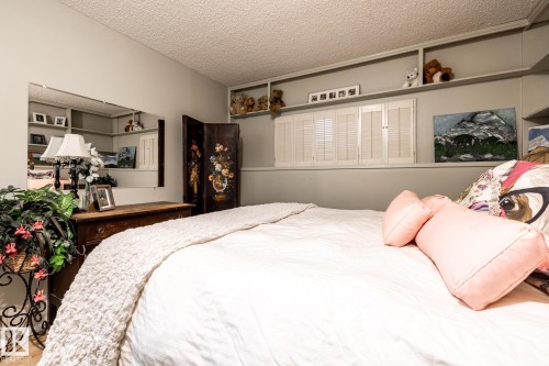 Bedroom featuring a textured ceiling - 69 Amherst Crescent, St. Albert, AB - Indoor Photo Showing Bedroom