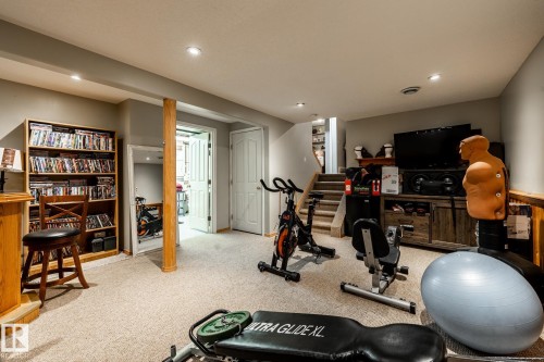 Workout room with light colored carpet and recessed lighting - 69 Amherst Crescent, St. Albert, AB - Indoor Photo Showing Gym Room