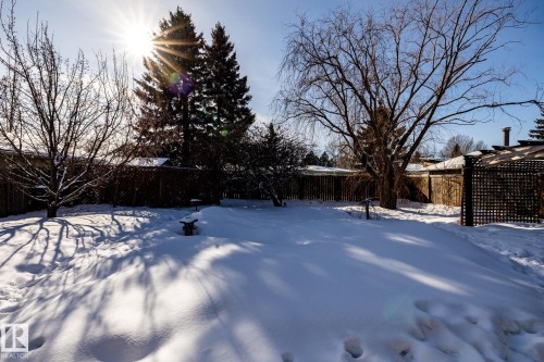 Snowy yard with a fenced backyard - 69 Amherst Crescent, St. Albert, AB - Outdoor