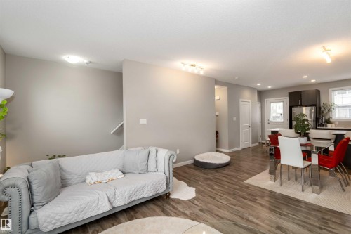 Living area with wood finished floors and recessed lighting - 31 2803 James Mowatt Trail, Edmonton, AB - Indoor