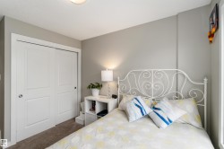 Carpeted bedroom featuring a closet - 