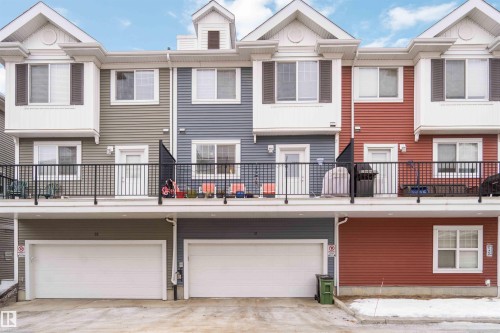 Back of property featuring an attached garage and a balcony - 31 2803 James Mowatt Trail, Edmonton, AB - Outdoor With Balcony With Facade