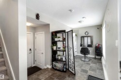 Full bathroom featuring a textured ceiling and stone finish flooring - 