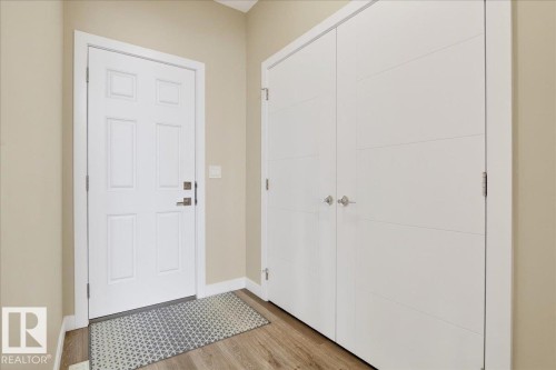 Door to the back yard & covered deck - 80 Maple Crescent, Gibbons, AB - Indoor Photo Showing Other Room