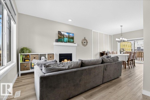 80 Maple Crescent, Gibbons, AB - Indoor Photo Showing Living Room With Fireplace