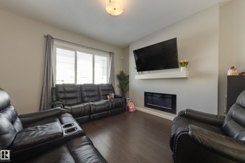 6687 Cardinal Road, Edmonton, AB - Indoor Photo Showing Living Room With Fireplace