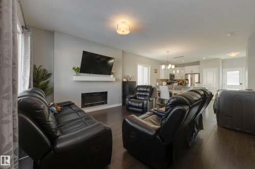 6687 Cardinal Road, Edmonton, AB - Indoor Photo Showing Living Room With Fireplace