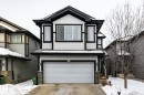 View of front of property with stone siding, driveway, and an attached garage - 3312 17B Avenue, Edmonton, AB  - Outdoor 