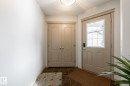 Doorway featuring tile patterned floors and baseboards - 3312 17B Avenue, Edmonton, AB  - Indoor Photo Showing Other Room 