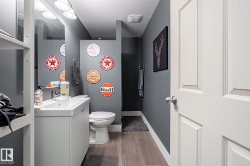 Bathroom with vanity and light wood-style floors - 3312 17B Avenue, Edmonton, AB - Indoor Photo Showing Laundry Room