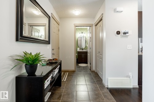 Entryway with a textured ceiling and tile patterned floors - 3312 17B Avenue, Edmonton, AB - Indoor Photo Showing Other Room