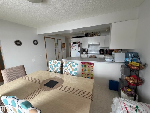 Dining space with a textured ceiling - 101 1 Aberdeen Way, Stony Plain, AB - Indoor