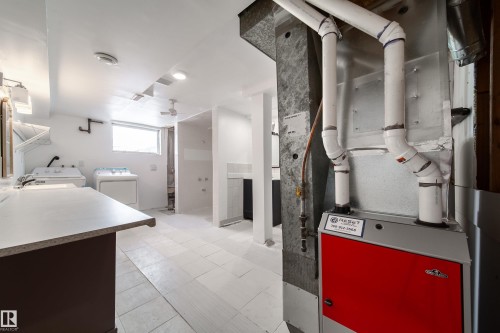Utilities with heating unit and washer and clothes dryer - 11430 81 Street, Edmonton, AB - Indoor