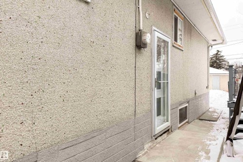 View of side of property featuring stucco siding - 11430 81 Street, Edmonton, AB - Outdoor