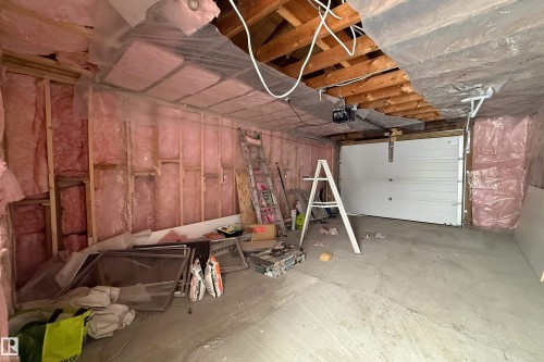 Garage featuring a garage door opener - 11430 81 Street, Edmonton, AB - Indoor Photo Showing Garage